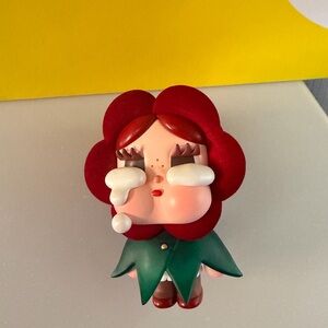 From PopMart is Whimsical Red Flower Figurine